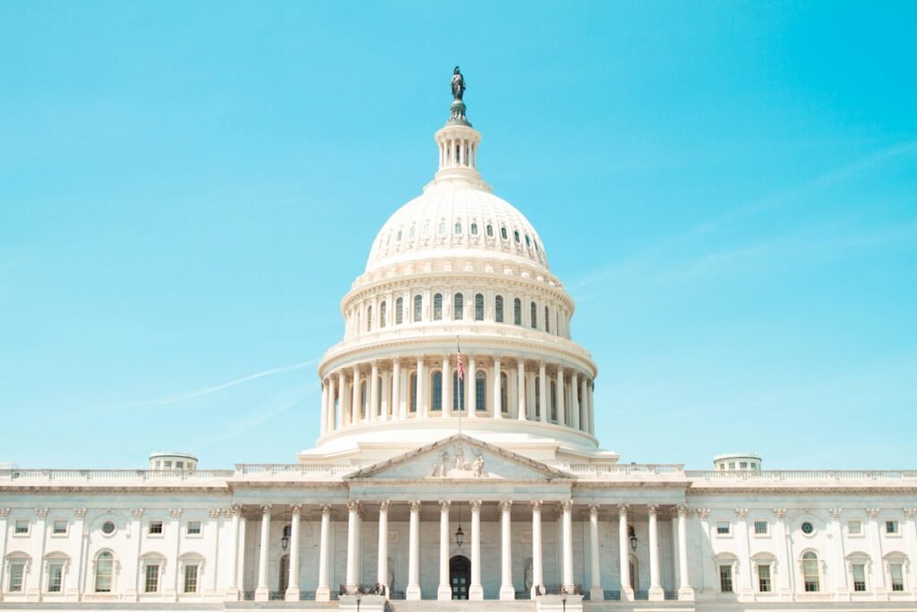 The US Capitol building in Washington, DC, under a blue sky
